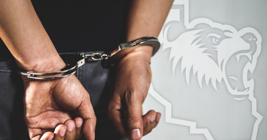 Handcuffs on mans hands